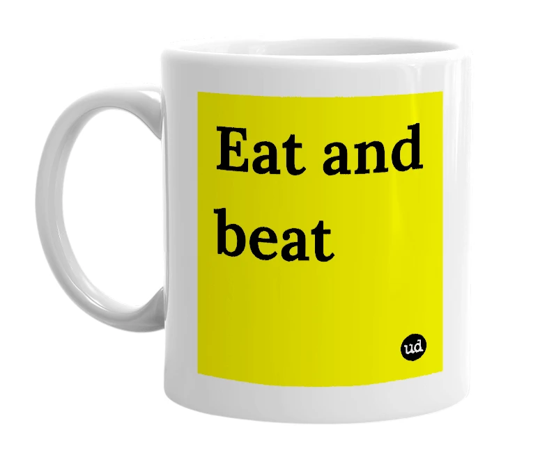 White mug with 'Eat and beat' in bold black letters