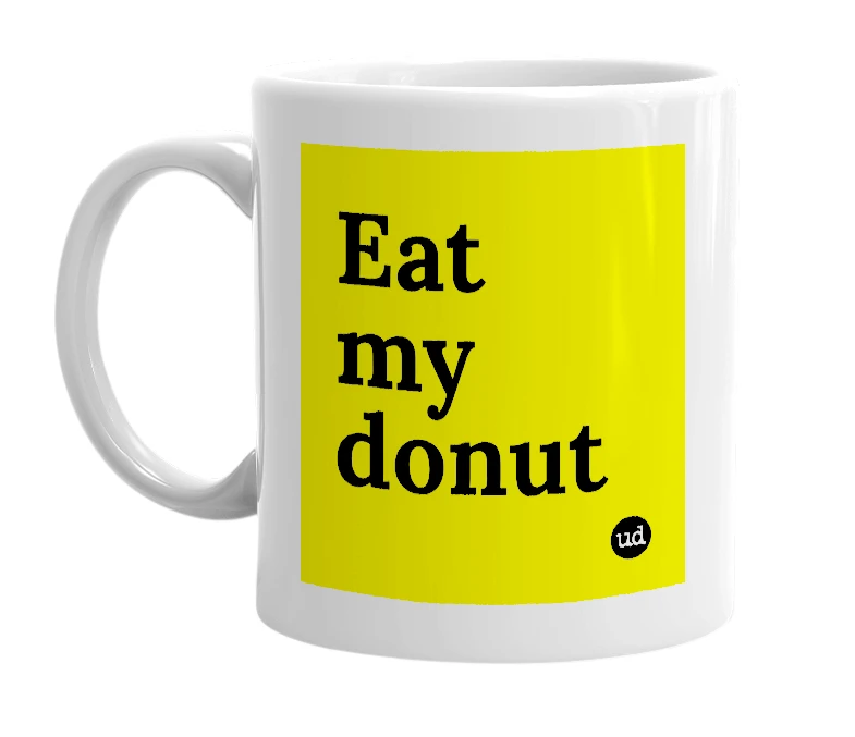 White mug with 'Eat my donut' in bold black letters