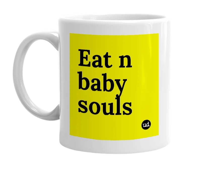 White mug with 'Eat n baby souls' in bold black letters