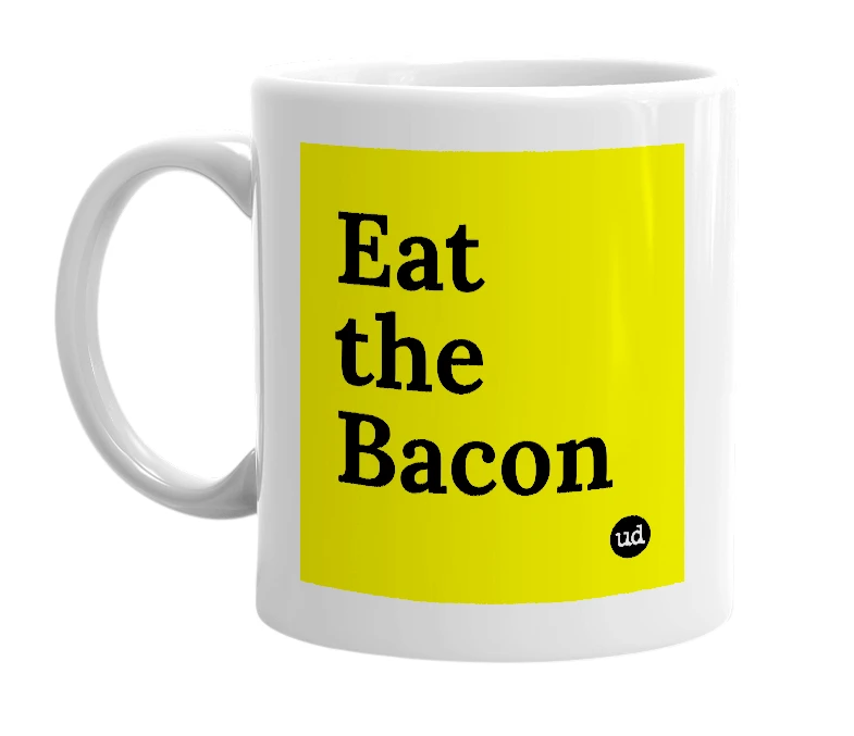 White mug with 'Eat the Bacon' in bold black letters