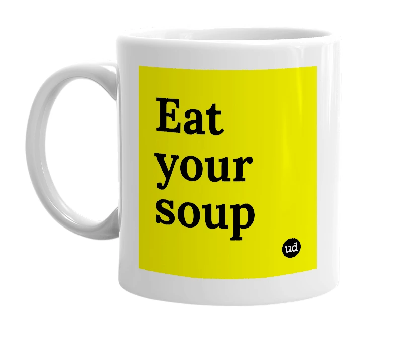 White mug with 'Eat your soup' in bold black letters