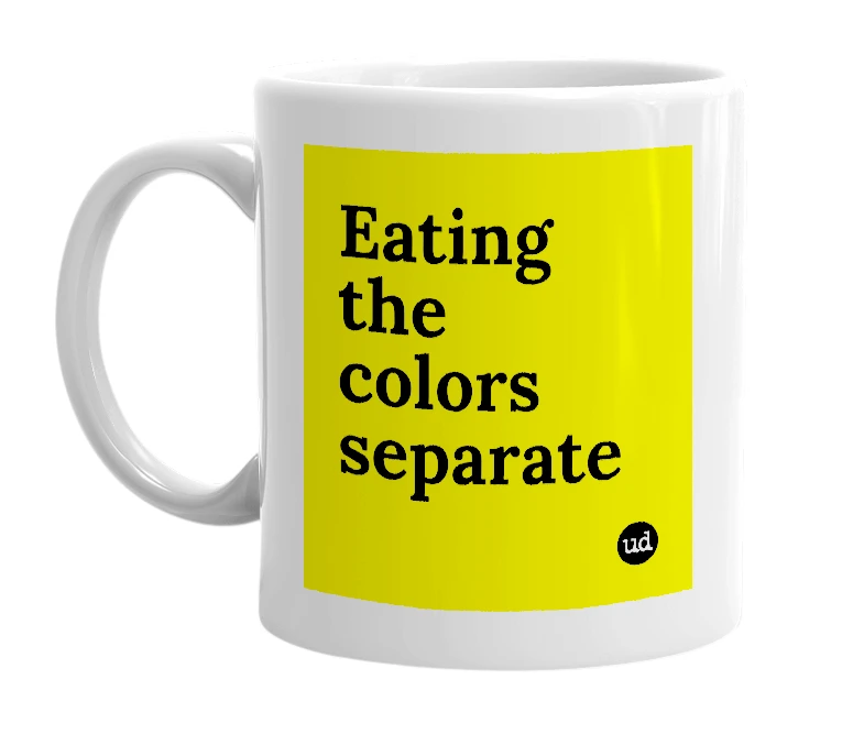 White mug with 'Eating the colors separate' in bold black letters