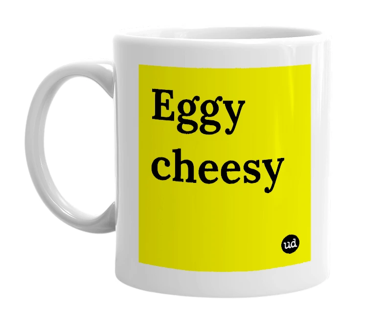 White mug with 'Eggy cheesy' in bold black letters