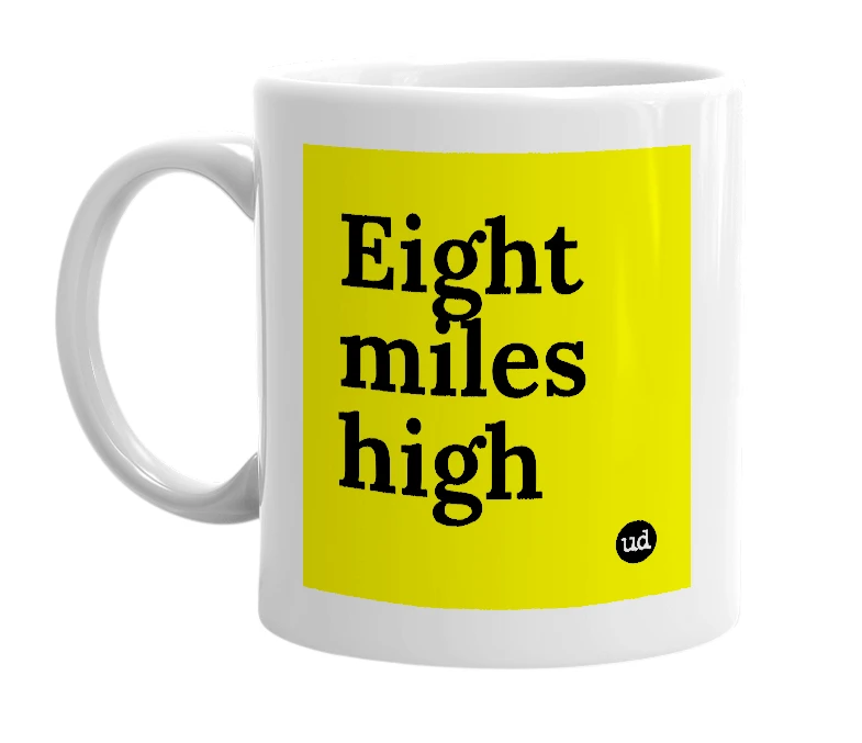 White mug with 'Eight miles high' in bold black letters
