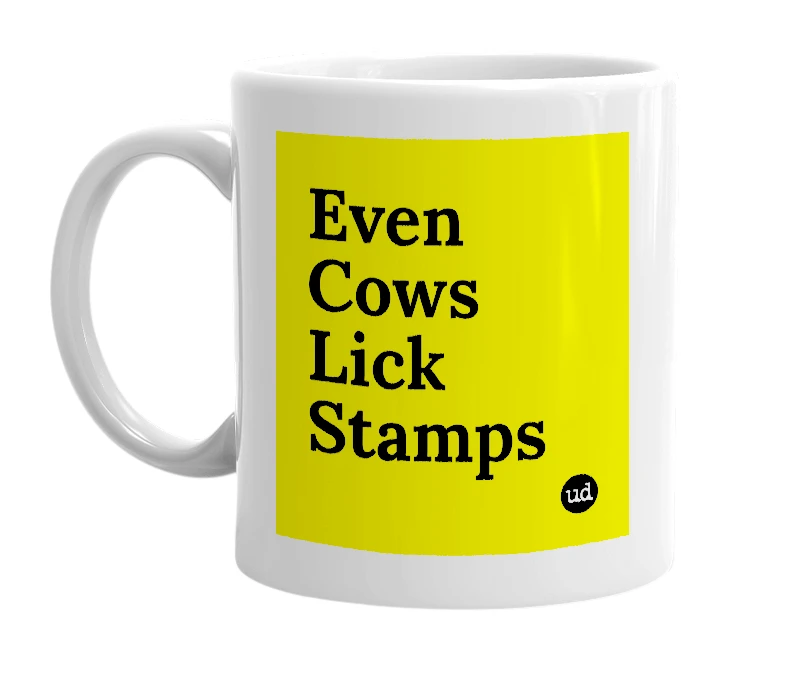 White mug with 'Even Cows Lick Stamps' in bold black letters