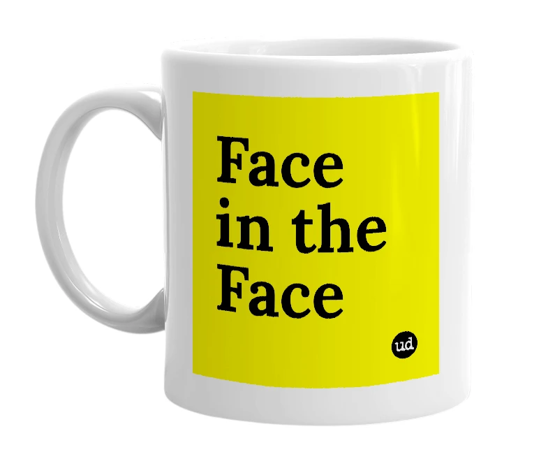 White mug with 'Face in the Face' in bold black letters