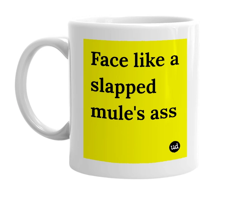 White mug with 'Face like a slapped mule's ass' in bold black letters