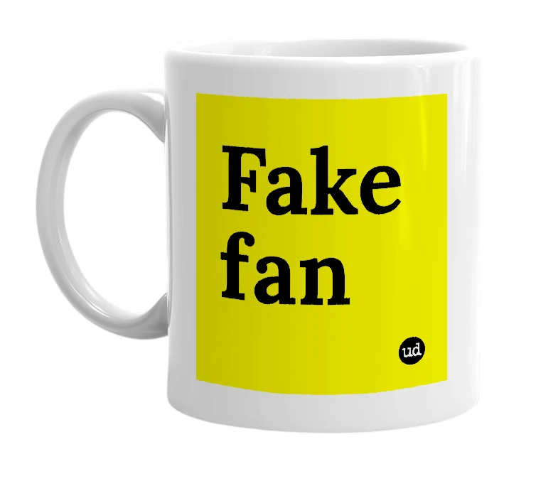 White mug with 'Fake fan' in bold black letters