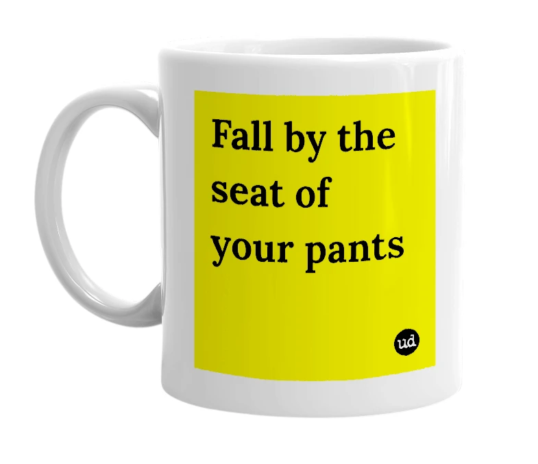 White mug with 'Fall by the seat of your pants' in bold black letters