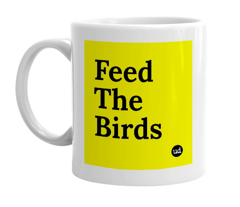 White mug with 'Feed The Birds' in bold black letters