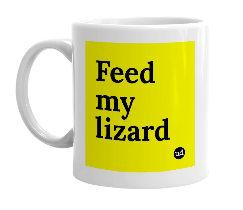 White mug with 'Feed my lizard' in bold black letters