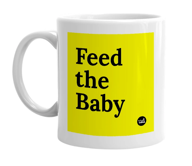 White mug with 'Feed the Baby' in bold black letters