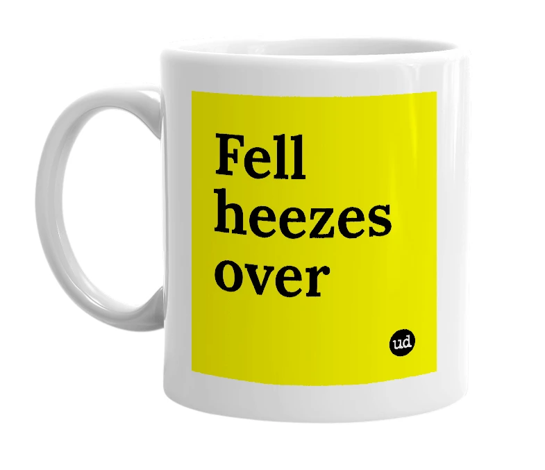 White mug with 'Fell heezes over' in bold black letters