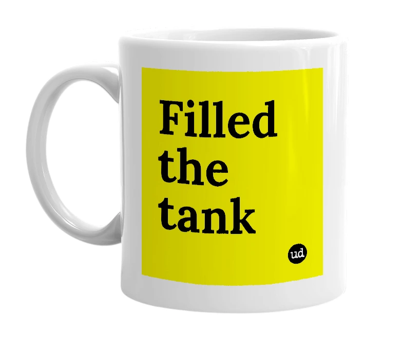 White mug with 'Filled the tank' in bold black letters