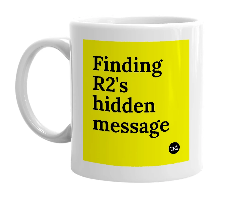 White mug with 'Finding R2's hidden message' in bold black letters