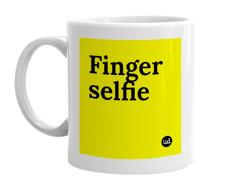 White mug with 'Finger selfie' in bold black letters