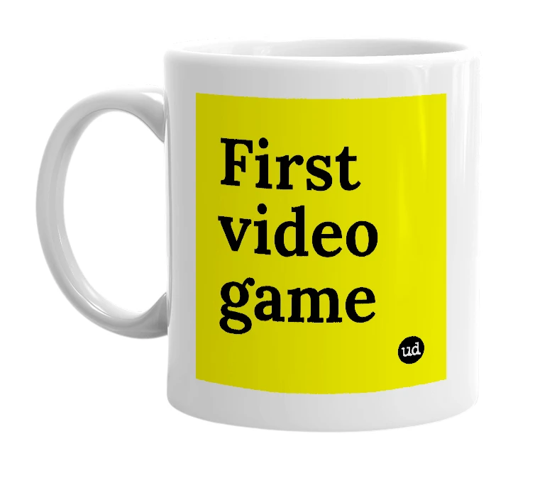White mug with 'First video game' in bold black letters