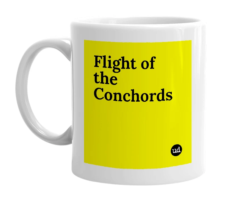 White mug with 'Flight of the Conchords' in bold black letters