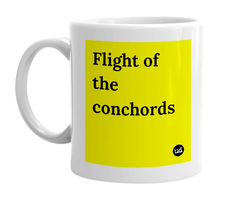White mug with 'Flight of the conchords' in bold black letters