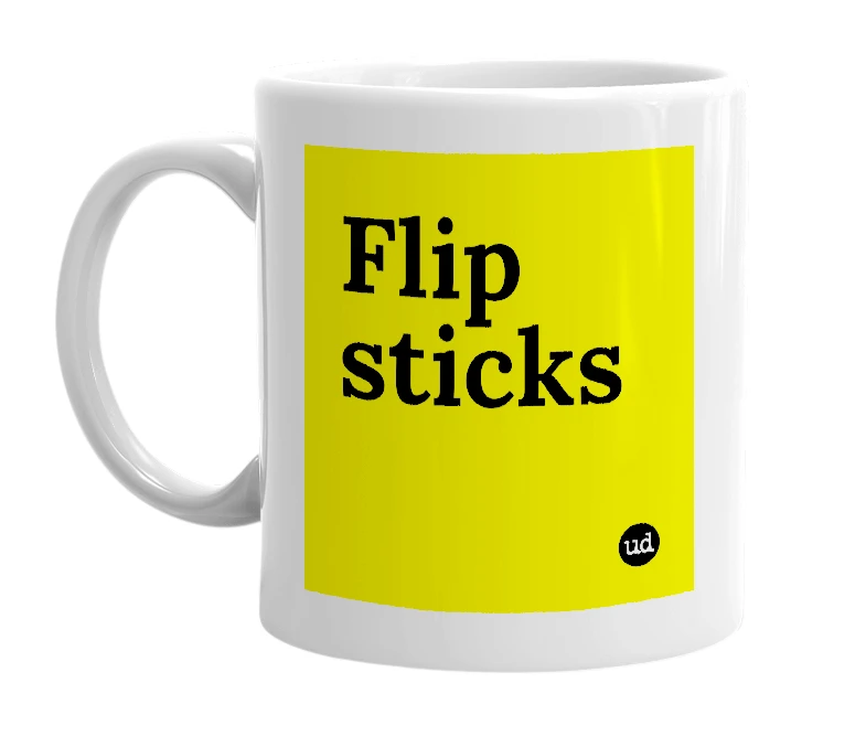 White mug with 'Flip sticks' in bold black letters