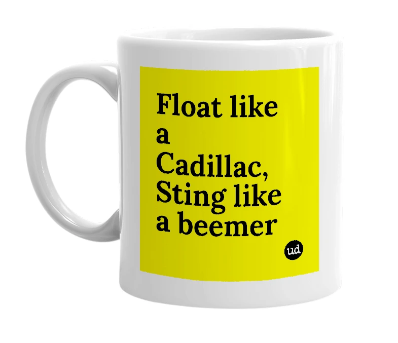 White mug with 'Float like a Cadillac, Sting like a beemer' in bold black letters