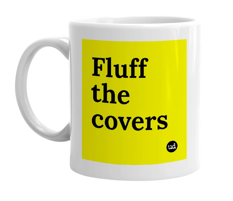 White mug with 'Fluff the covers' in bold black letters