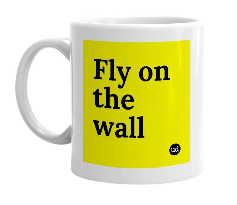 White mug with 'Fly on the wall' in bold black letters