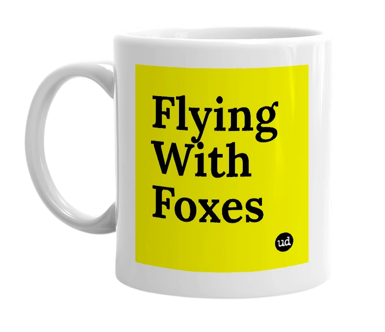 White mug with 'Flying With Foxes' in bold black letters