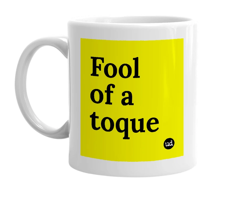 White mug with 'Fool of a toque' in bold black letters