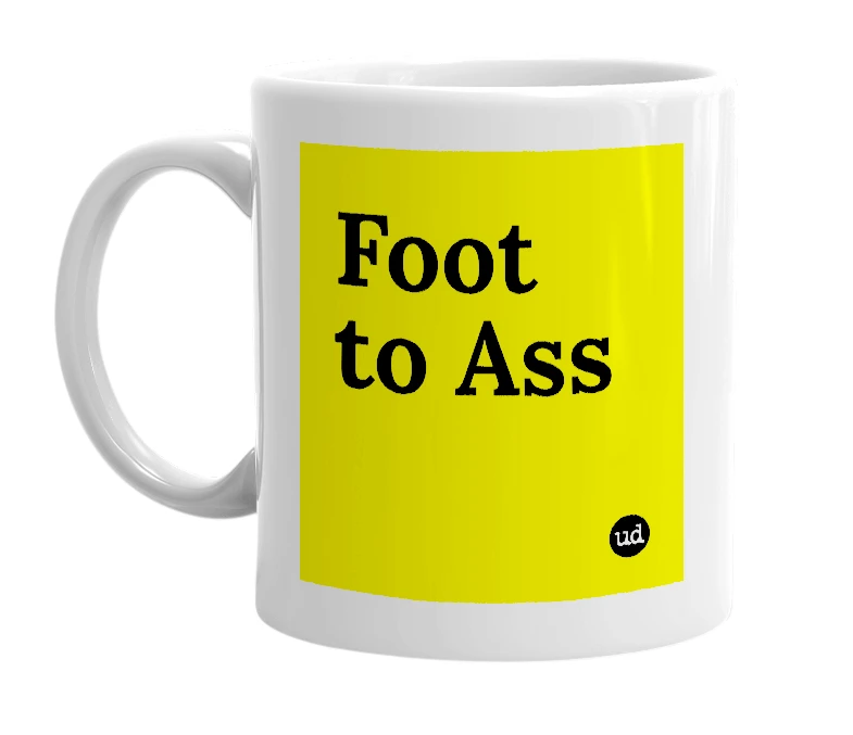 White mug with 'Foot to Ass' in bold black letters