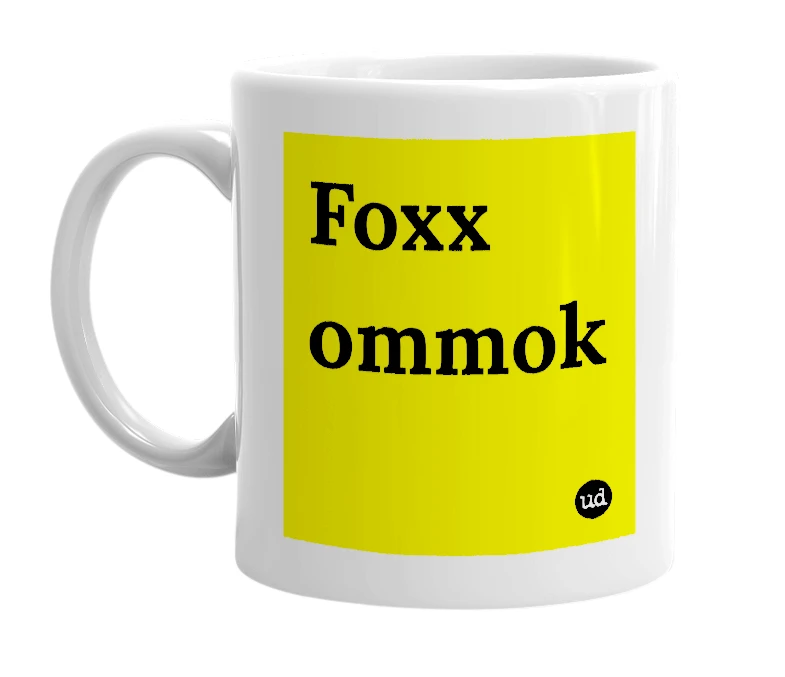 White mug with 'Foxx ommok' in bold black letters