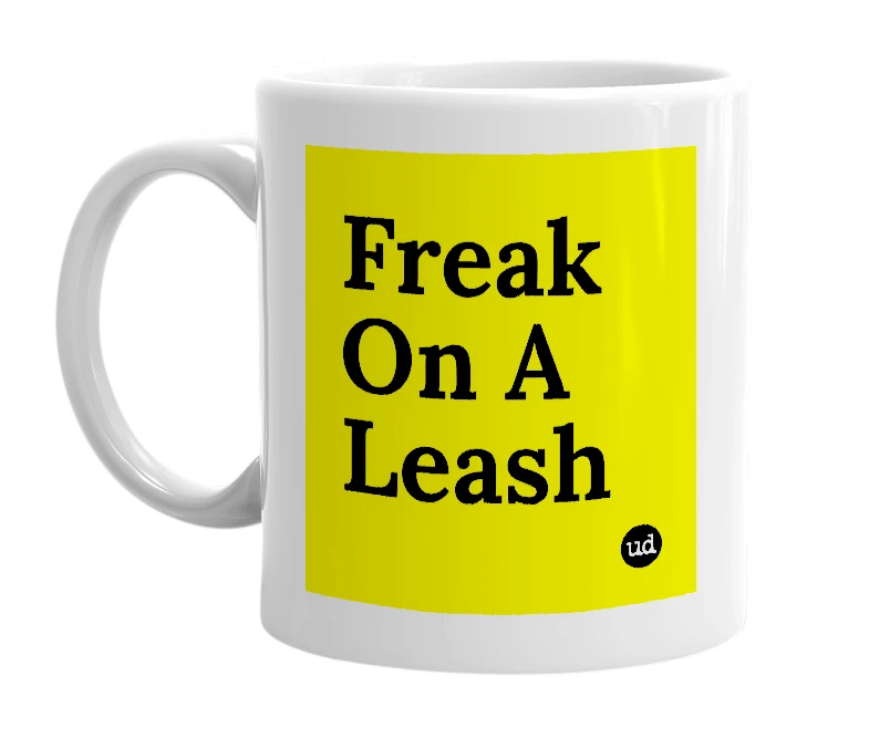 White mug with 'Freak On A Leash' in bold black letters