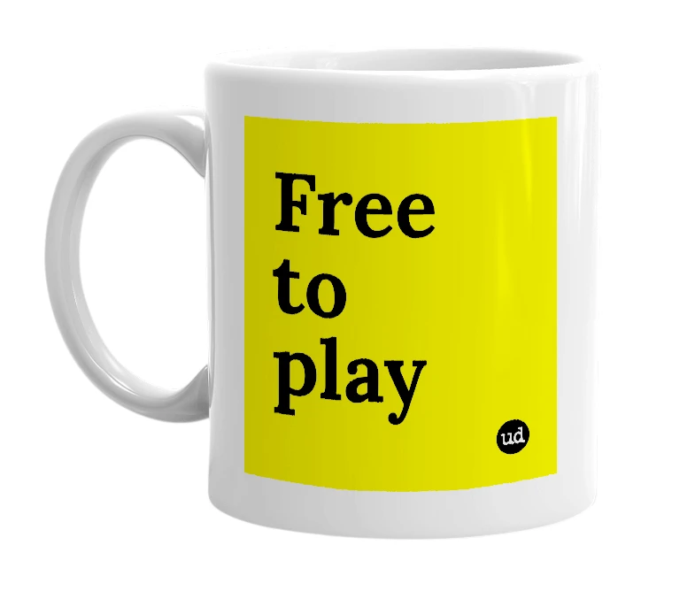 White mug with 'Free to play' in bold black letters