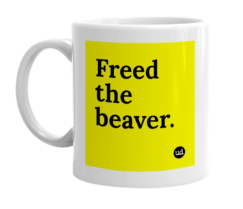 White mug with 'Freed the beaver.' in bold black letters