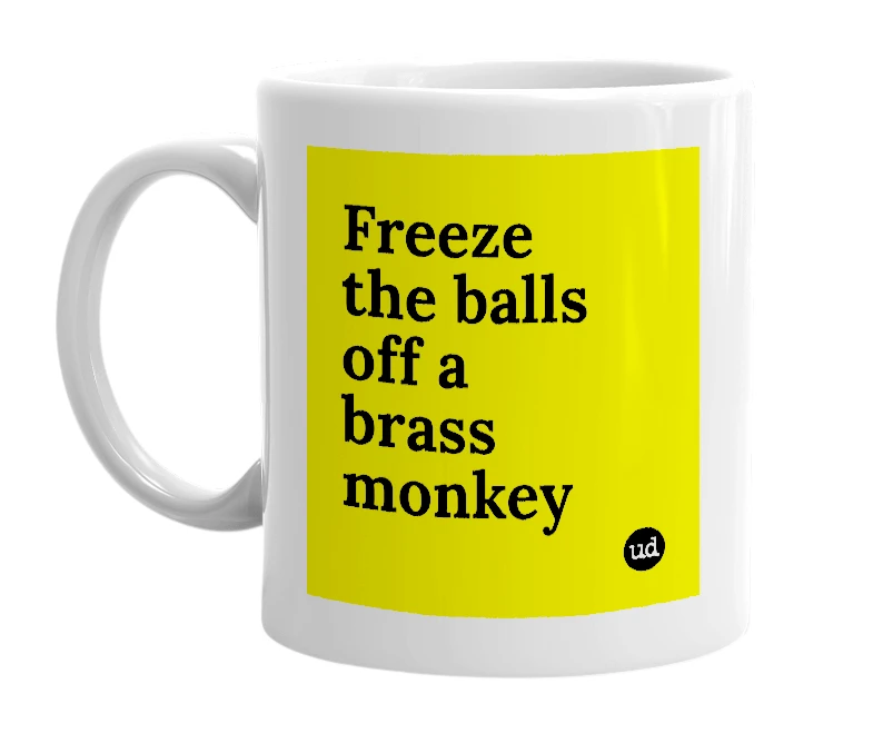 White mug with 'Freeze the balls off a brass monkey' in bold black letters