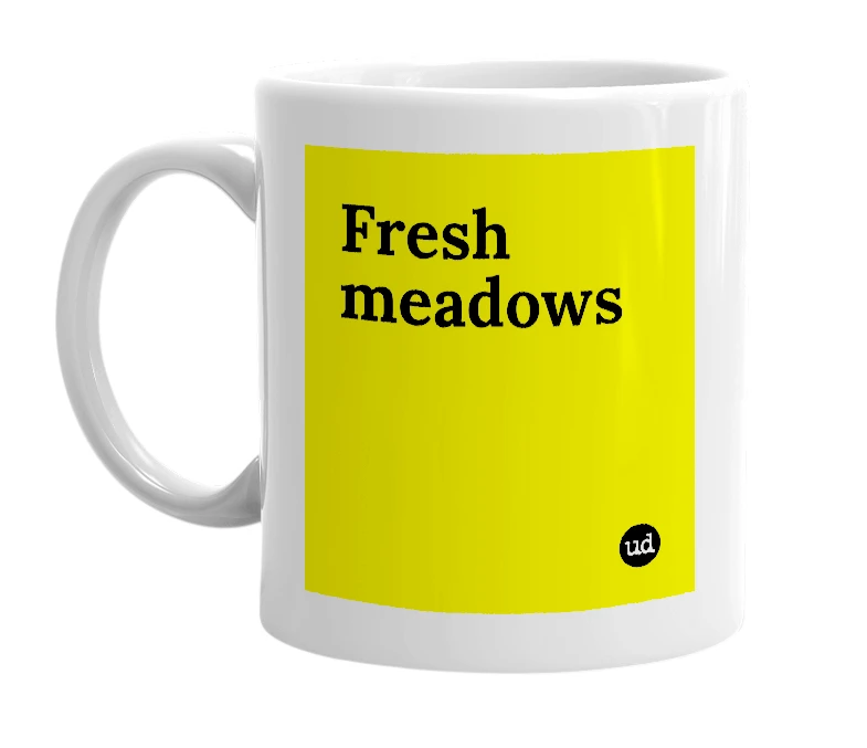 White mug with 'Fresh meadows' in bold black letters