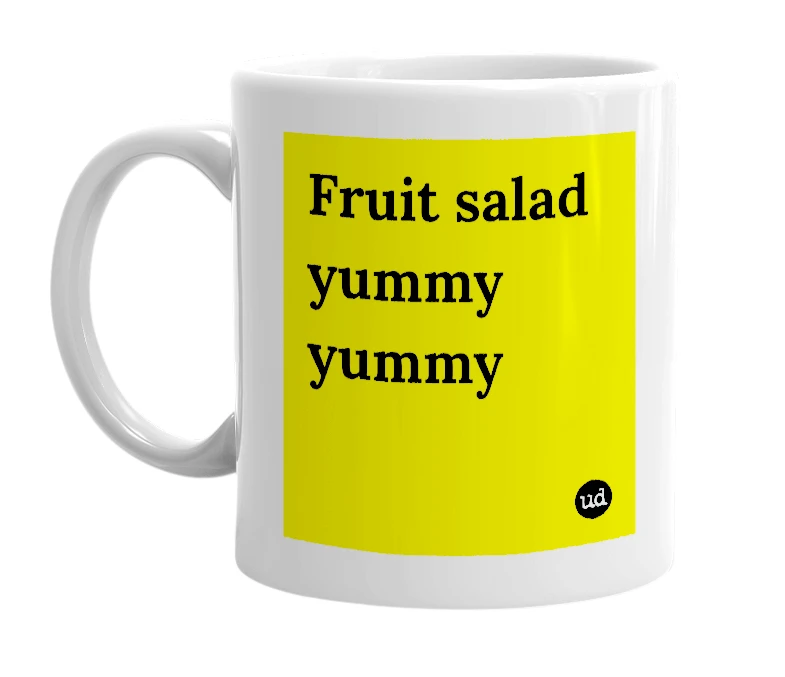 White mug with 'Fruit salad yummy yummy' in bold black letters