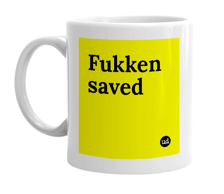 White mug with 'Fukken saved' in bold black letters
