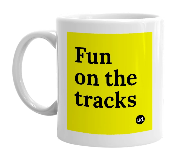 White mug with 'Fun on the tracks' in bold black letters