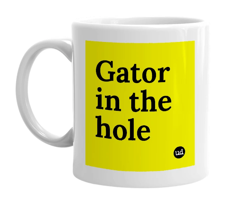 White mug with 'Gator in the hole' in bold black letters