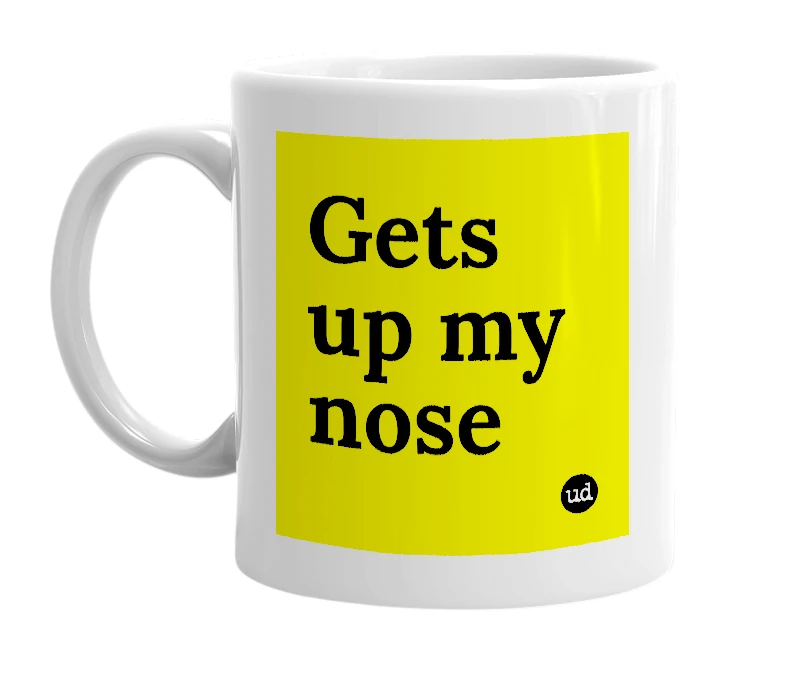 White mug with 'Gets up my nose' in bold black letters