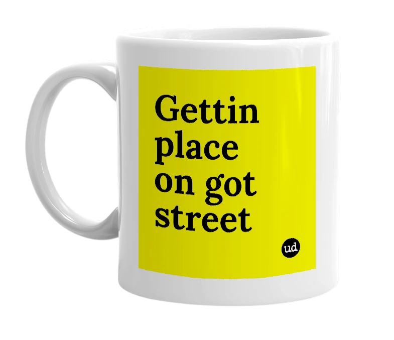 White mug with 'Gettin place on got street' in bold black letters