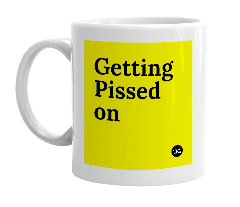 White mug with 'Getting Pissed on' in bold black letters
