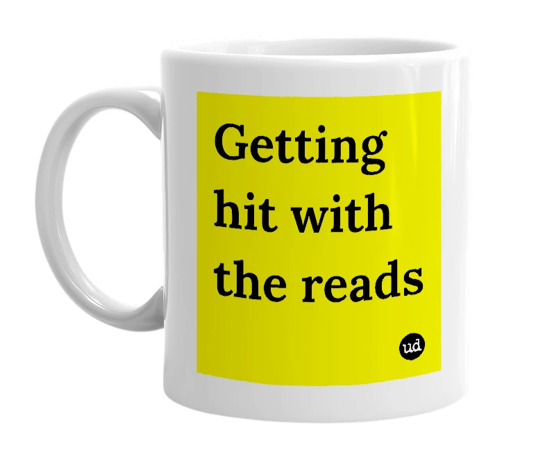 White mug with 'Getting hit with the reads' in bold black letters