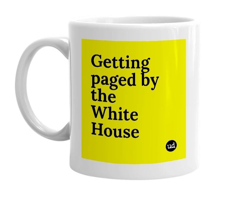 White mug with 'Getting paged by the White House' in bold black letters