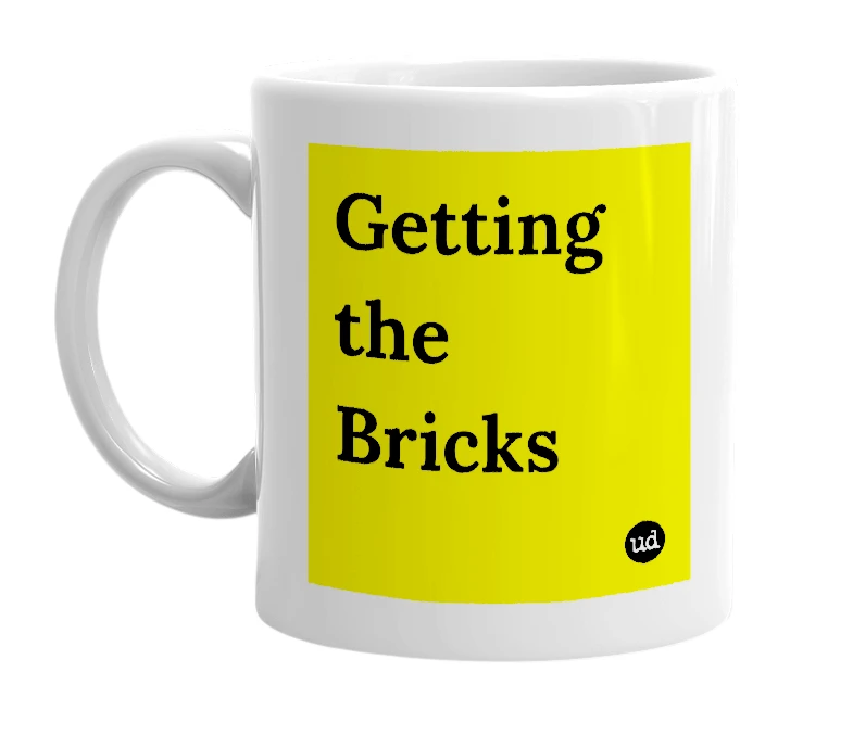 White mug with 'Getting the Bricks' in bold black letters