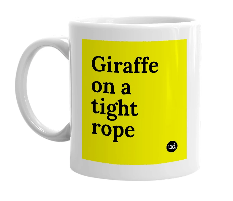 White mug with 'Giraffe on a tight rope' in bold black letters