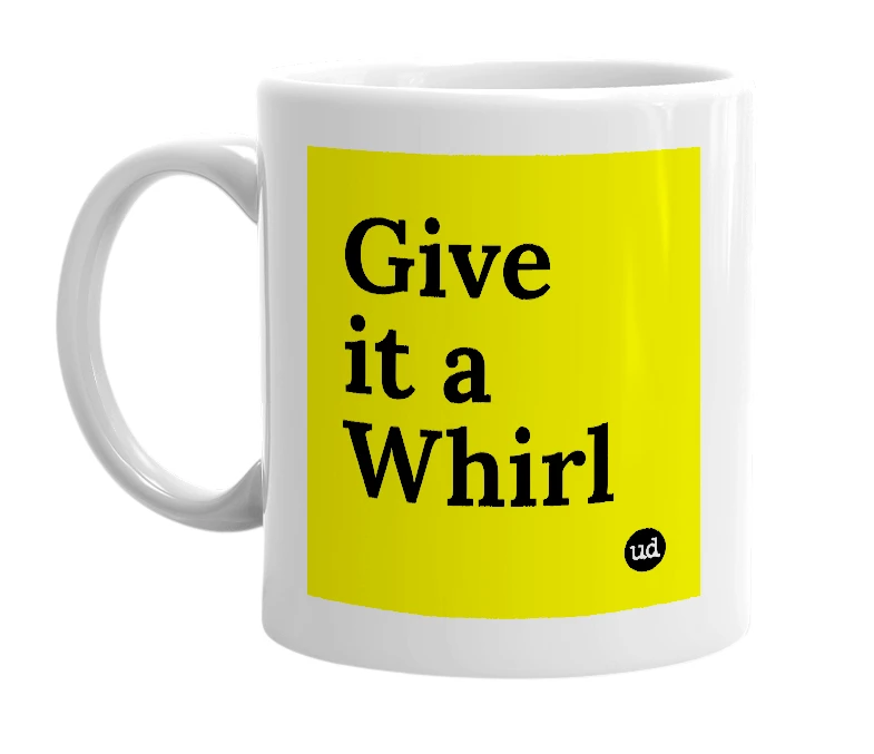 White mug with 'Give it a Whirl' in bold black letters