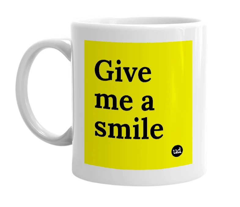 White mug with 'Give me a smile' in bold black letters
