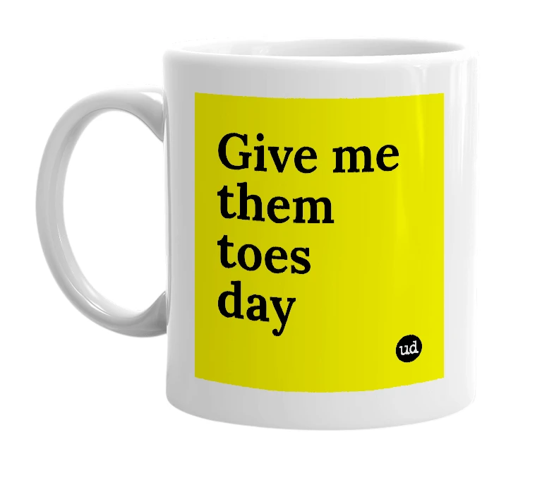 White mug with 'Give me them toes day' in bold black letters